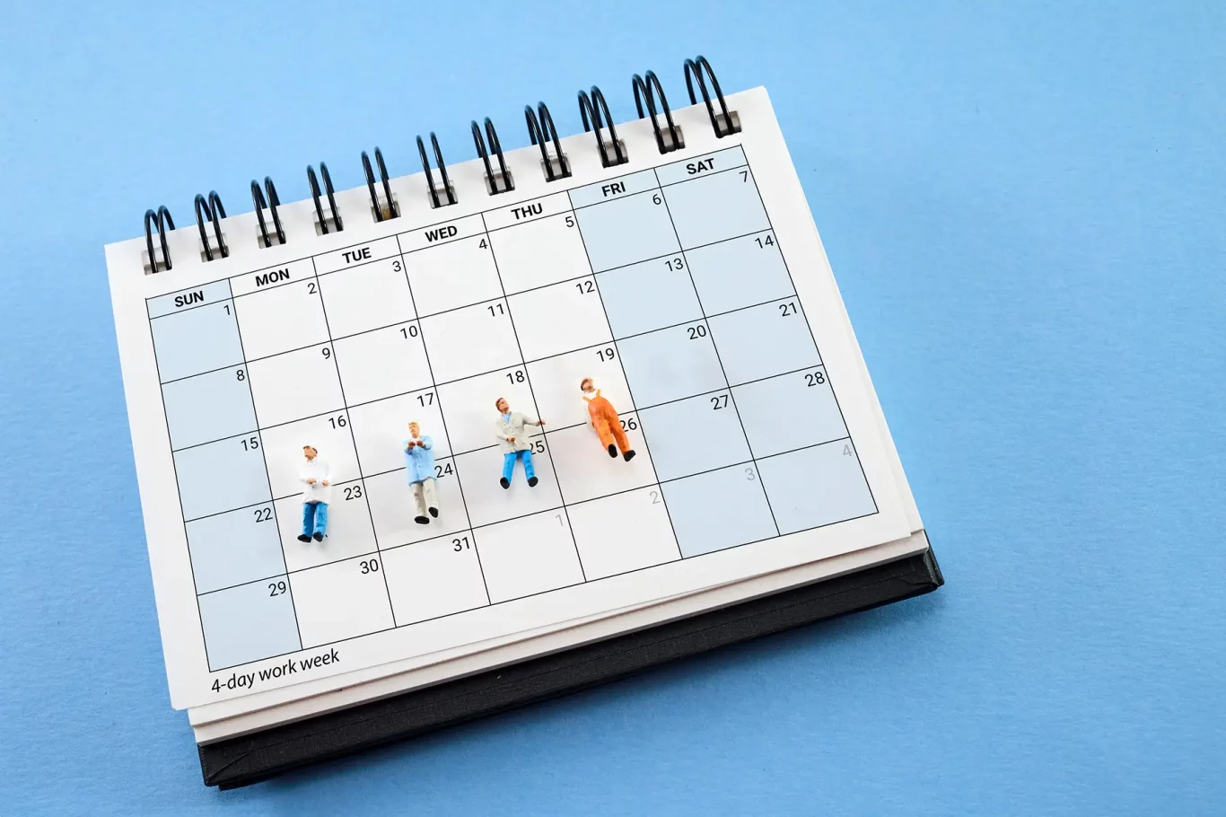 Concept of four-day work week. Printed calendar for a 4 day working week.