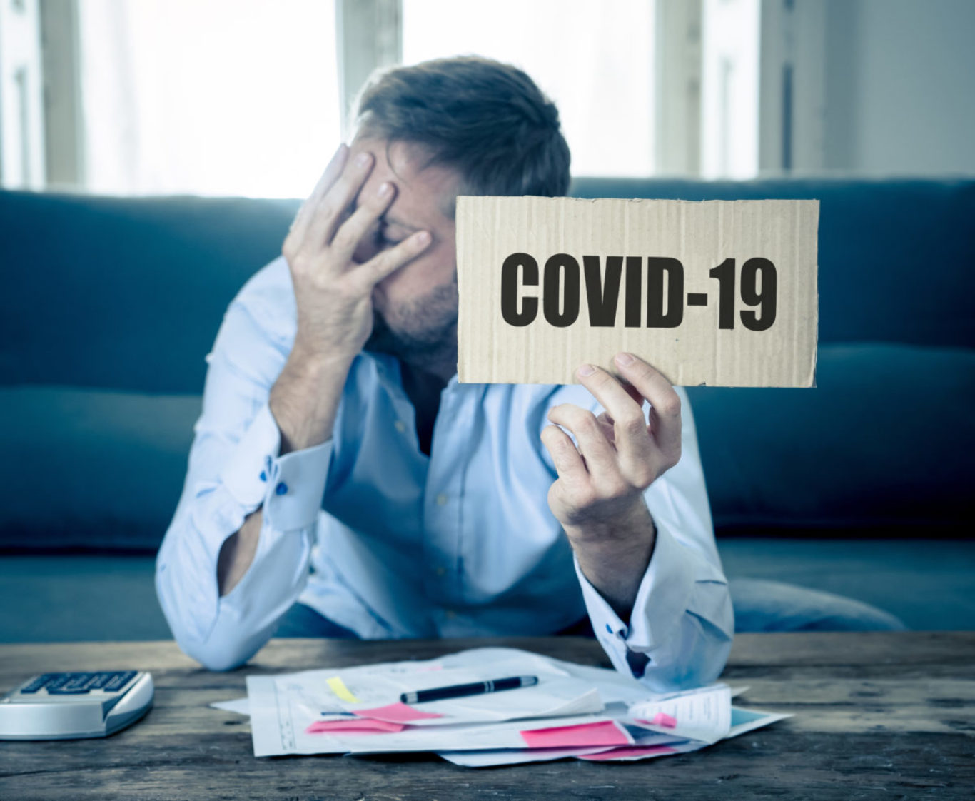 COVID-19 Global economic Recession. Depressed man desperate not able to pay rent and expenses. Worker affected by global economic recession amid to Coronavirus job losses and financial impact.