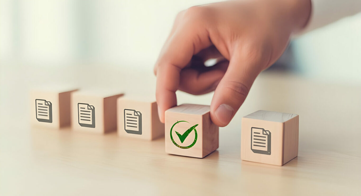 Hand selecting wooden block with green checkmark icon among docu