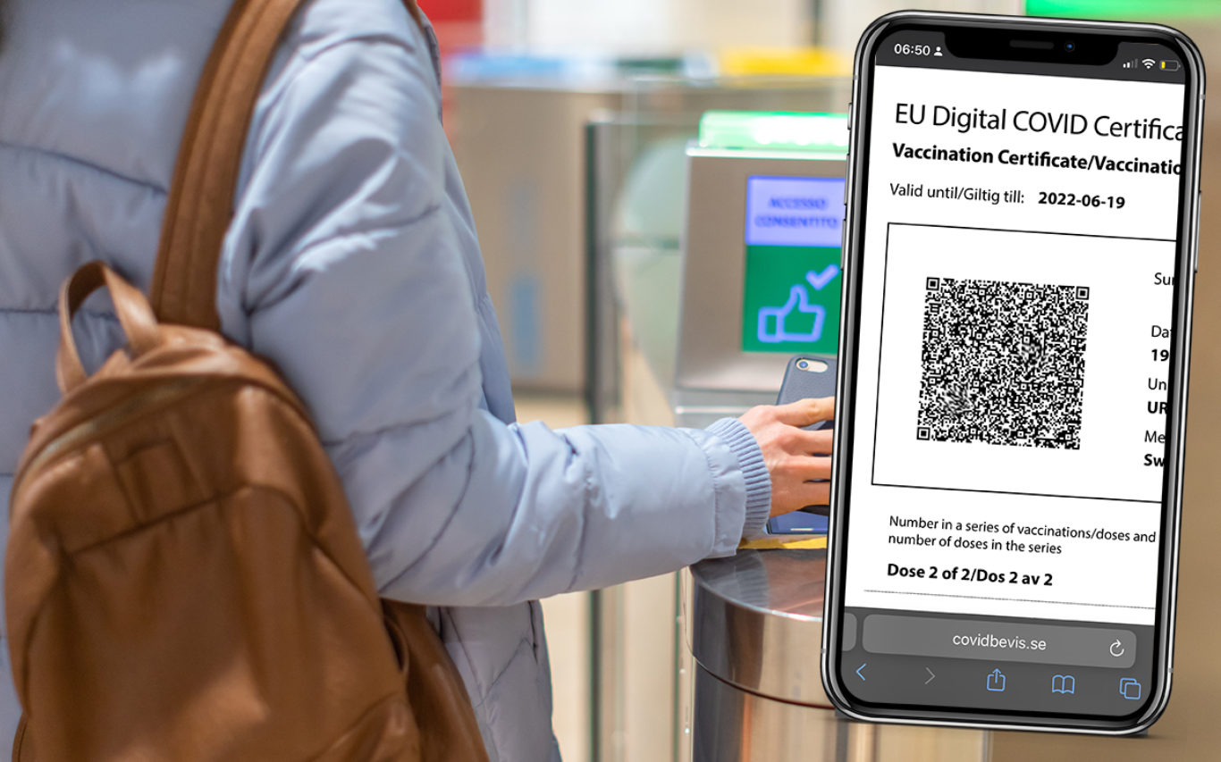 Electronic Boarding pass and passport control in the airport - hand with boarding pass on smartphone at the turnstile.