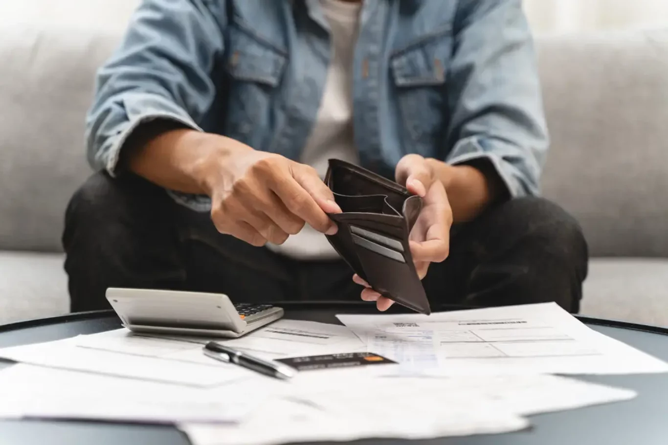 Bankruptcy problem financial concept, Young man opening empty wallet stress to find money to pay debt mortgage  period.