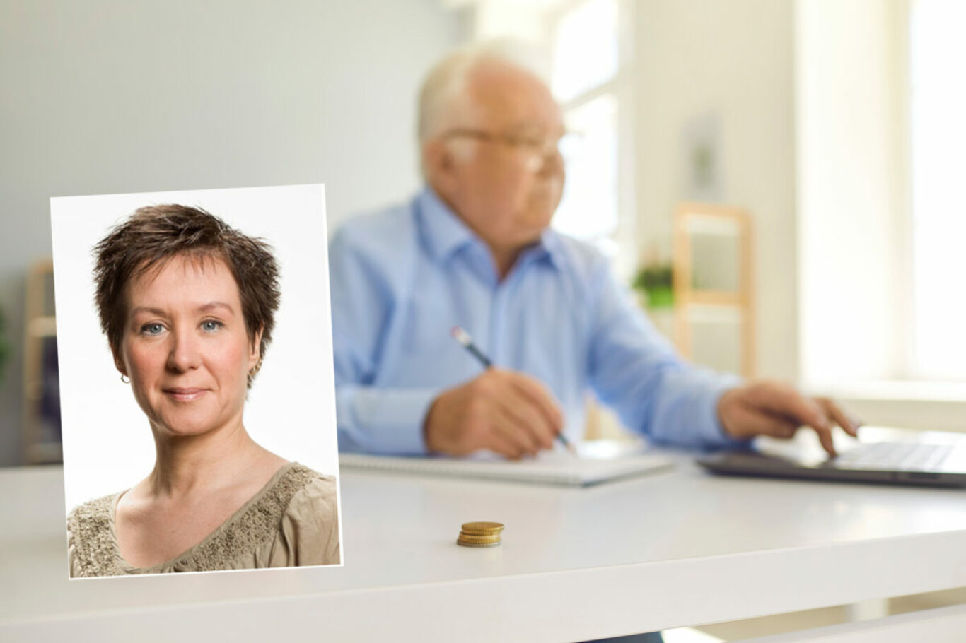 Piggy bank in soft focus on desk with blurred elderly man using laptop to fill out Internet pension application, do accounting and paperwork at home, manage personal finance or pay bills online